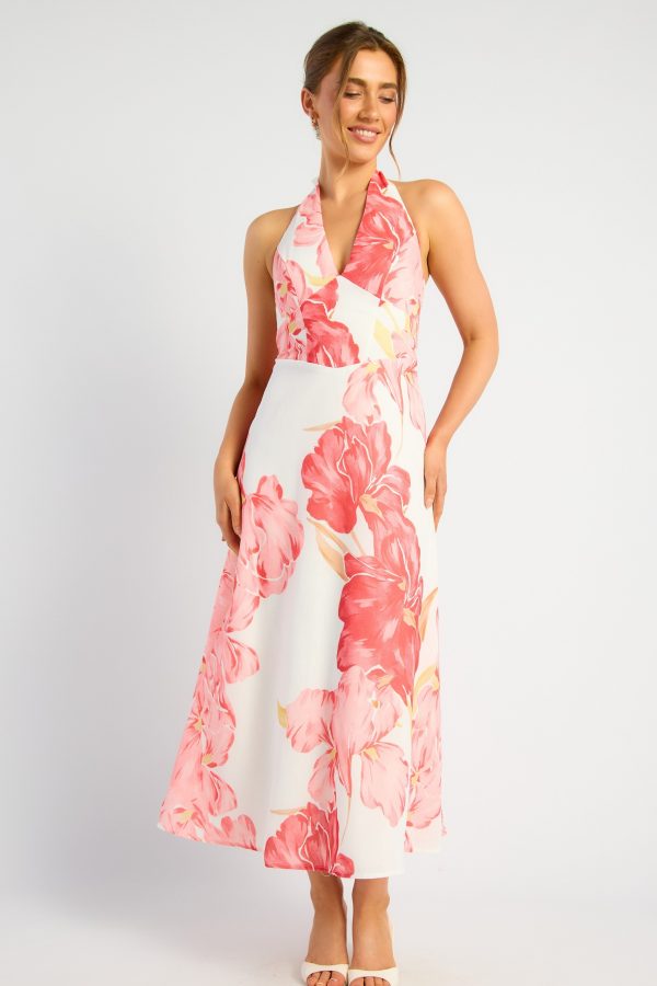 KoKo Coral Blossom ivory halter maxi dress with oversized coral and pink flowers, a V-neckline and flowing A-line skirt, shown on a model